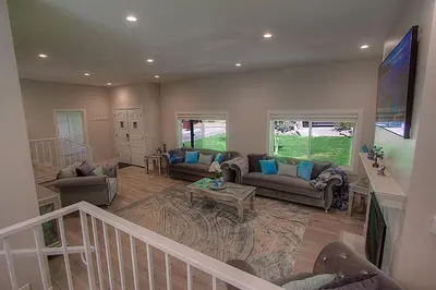a living room with couches and a table at Creek Side Summit home in Stateline