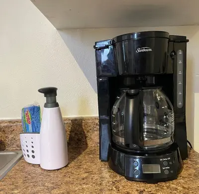 a coffee maker sitting on a counter next to a toaster at Sierra Sunset Cottage -Yosemite area vacation cottage in Ahwahnee