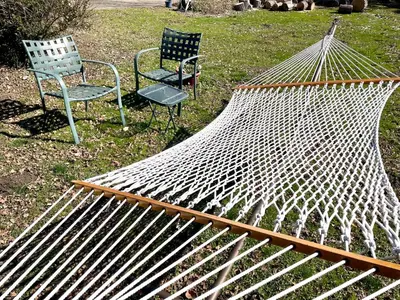 two chairs and a hammock in a yard at Sierra Sunset Cottage -Yosemite area vacation cottage in Ahwahnee