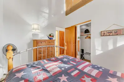a bedroom with a bed with a quilt on it at Three-Bedroom House in South Lake Tahoe
