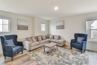 a living room with a couch and two chairs at Pool Table and Patio! Spacious Merced Getaway in Merced