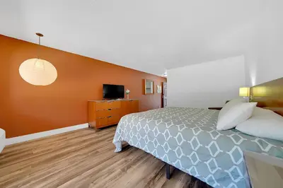 a hotel room with a bed and a tv at Amador Hotel in Pioneer