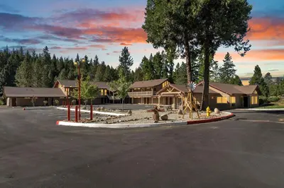 a parking lot with a fire hydrant in front of a building at Amador Hotel in Pioneer