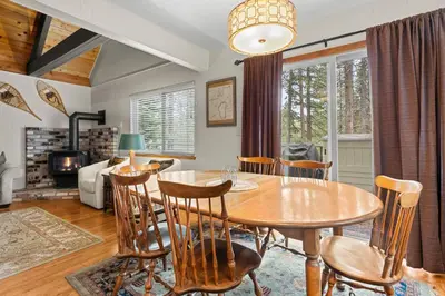 a dining room with a table and chairs at Cozy Cabin home in South Lake Tahoe