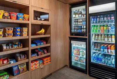 a refrigerator filled with lots of food and drinks at Fairfield by Marriott Inn & Suites Stockton Lathrop in Lathrop