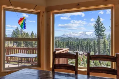 a dining room with a table and a large window at Shaquinaw! home in South Lake Tahoe