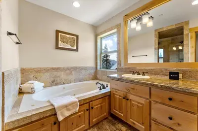 a bathroom with a tub and a sink at Shaquinaw! home in South Lake Tahoe