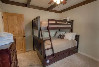 a bedroom with two bunk beds in a room at Snowshoe Chalet cabin in South Lake Tahoe