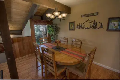 a dining room with a wooden table and chairs at Bear Lake Hideaway condo in South Lake Tahoe