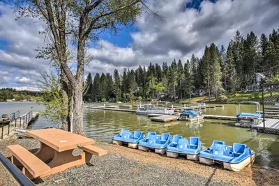 a group of blue chairs sitting in the water at Pine Mountain Lake Cabin with Grill! in Groveland