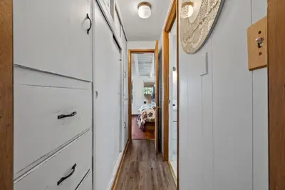a hallway of a home with white cabinets at Twain Harte Cabin in Town & Lake access in Twain Harte