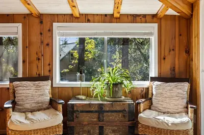 a room with two chairs and a table and a window at Twain Harte Cabin in Town & Lake access in Twain Harte