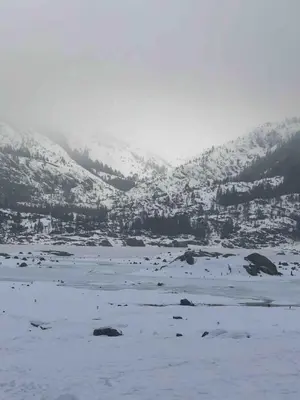 a snow covered valley with a city in the distance at Cabin #2 in Strawberry