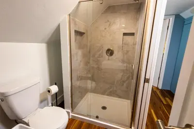 a bathroom with a shower with a toilet at Cabin #6 in Strawberry