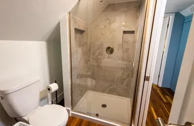 a bathroom with a shower with a toilet at Cabin #6 in Strawberry
