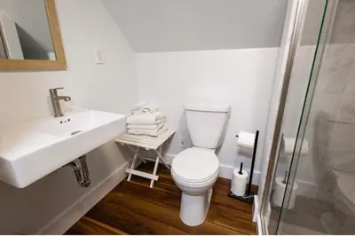 a bathroom with a toilet and a sink and a shower at Cabin #6 in Strawberry
