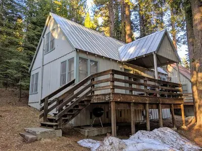 a large house with a roof on top of it at Cabin #8 in Strawberry