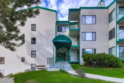 a large apartment building with a green awning at Heavenly Mountain Lake Retreat Near Skiing, Hiking & Biking in Stateline