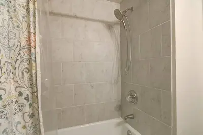 a bathroom with a shower with a tub and a shower curtain at Heavenly Mountain Lake Retreat Near Skiing, Hiking & Biking in Stateline