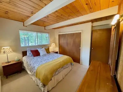 a bedroom with a large bed and a window at Blue Lake Chalet- 3 Bedroom + Loft/Pool Table in Arnold/Bear Valley (Pet-Friendly) in Arnold