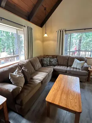 a living room with a couch and a coffee table at Blue Lake Chalet- 3 Bedroom + Loft/Pool Table in Arnold/Bear Valley (Pet-Friendly) in Arnold