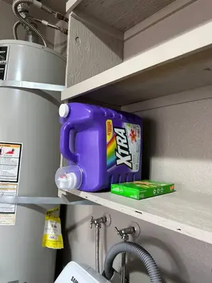 a shelf with a purple mug and a box on it at Cozy Getaway with King bed & 70inTV in Carmichael