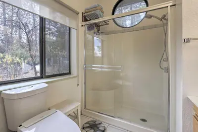 a bathroom with a shower and a toilet at Homey Colfax Getaway with Private Hot Tub! in Colfax