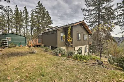 a house with a sign on the side of it at Homey Colfax Getaway with Private Hot Tub! in Colfax