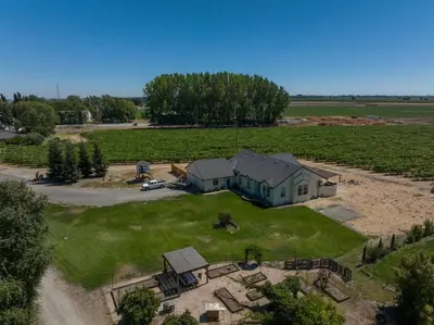 an aerial view of a house in a field at Luxe & Comfy Vineyard Estate ~ Breathtaking Views! in Clarksburg