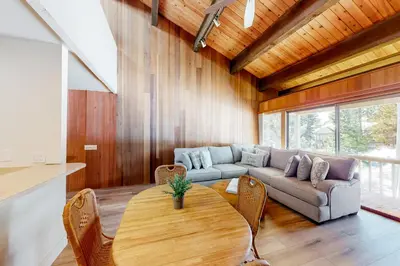 a living room with a table and a couch at Kingswood Village 60 in Kings Beach