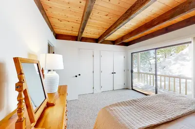 a bedroom with a bed and a window at Kingswood Village 60 in Kings Beach