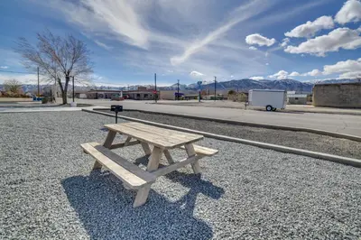 a wooden picnic table sitting on the side of a street at Renovated Hawthorne Apartment By Museums and Dining! in Hawthorne