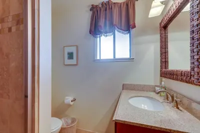 a bathroom with a sink and a mirror at Donner Lake Views Rustic Truckee Cabin! in Truckee