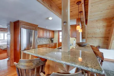 a kitchen with a large island in a cabin at Donner Lake Views Rustic Truckee Cabin! in Truckee