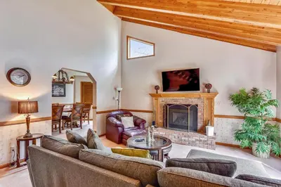 a living room with a couch and a fireplace at Minutes To Heavenly, Private Covered Hot Tub in South Lake Tahoe