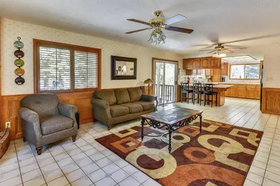 a living room with a couch and a table at Minutes To Heavenly, Private Covered Hot Tub in South Lake Tahoe