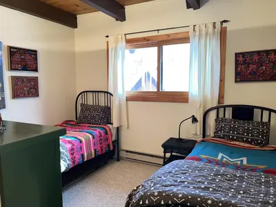 a bedroom with two beds and a window at Cabin Close To Hiking Trails And Ski Resorts in South Lake Tahoe