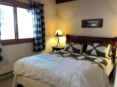 a bedroom with a bed and a window at Cabin Close To Hiking Trails And Ski Resorts in South Lake Tahoe