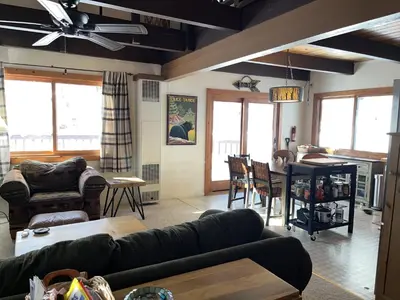 a living room with a couch and a table at Cabin Close To Hiking Trails And Ski Resorts in South Lake Tahoe