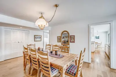 a dining room with a wooden table and chairs at Championship Pines in Incline Village