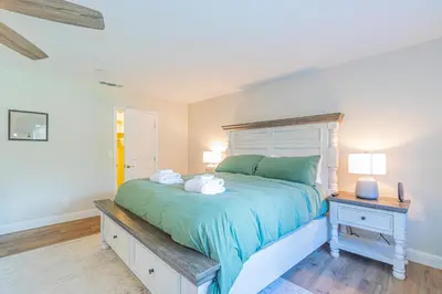 a bedroom with a bed with two towels on it at Mystic Mountain Villa, 14 miles from Yosemite in Oakhurst