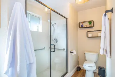 a bathroom with a shower and a toilet at Mystic Mountain Villa, 14 miles from Yosemite in Oakhurst