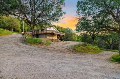 a house on the side of a dirt road at Casita 3 Rios Secluded Mountain Top Home Minutes to Sequoias & Kings Canyon in Three Rivers