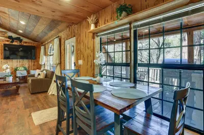 a dining room with a table and chairs at 9 Mi to Bass Lake Cabin with Fire Pit in Wishon! in Bass Lake Annex