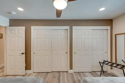 two white doors in a room with wood floors at Renovated Pioneer Home in Serene Wooded Setting! in Pioneer