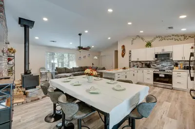 a kitchen and living room with a table and chairs at Renovated Pioneer Home in Serene Wooded Setting! in Pioneer
