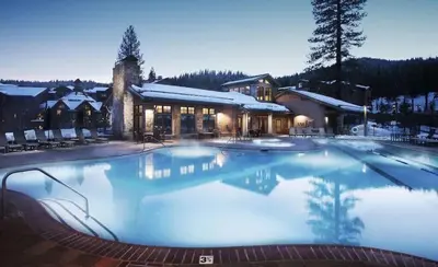 a large swimming pool in front of a building at Luxury Northstar Home| hot tub| walk to ski lifts in Truckee
