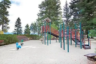 a playground with a slide in a park at North Lake Tahoe Cabin and Hot Tub in Tahoe City