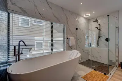 a bathroom with a large tub and a shower at Extra Spacious 2BR Cabin w Office and Outdoor Deck in Incline Village