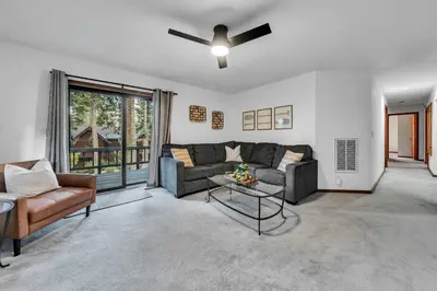 a living room with a couch and a ceiling fan at Talmont Pines 4BR Retreat with HOA Beach Access in Tahoe City